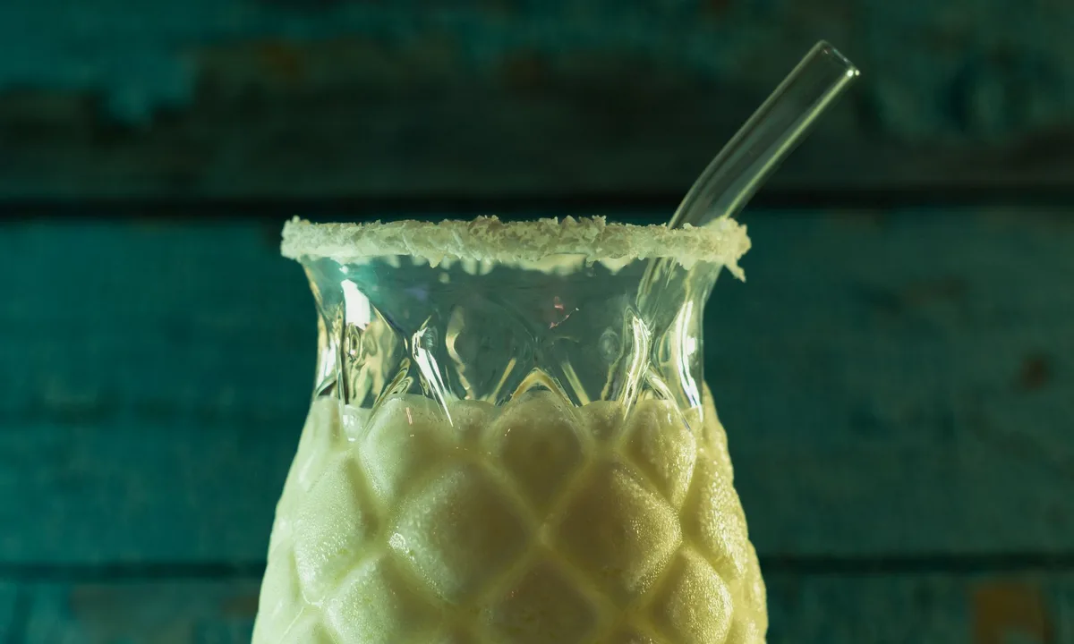 Tropical mocktail with pineapple garnish