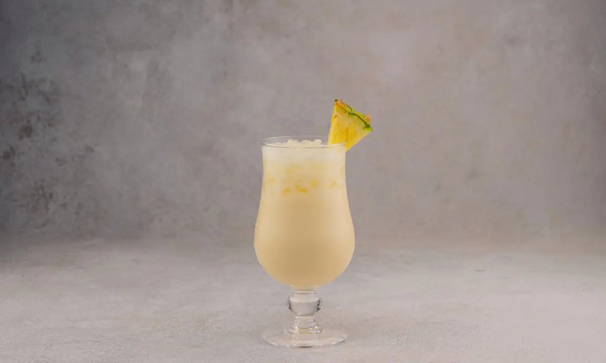 Pina colada with pineapple garnish